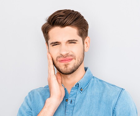 man with tooth pain