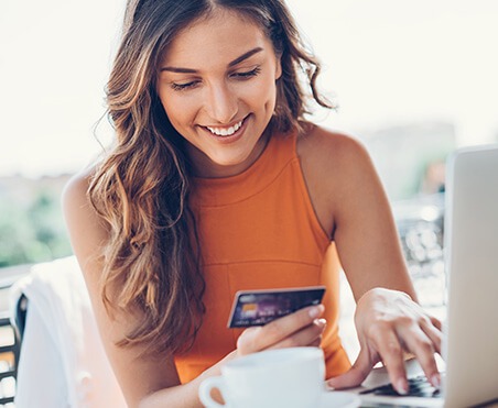 woman paying bill online with credit card