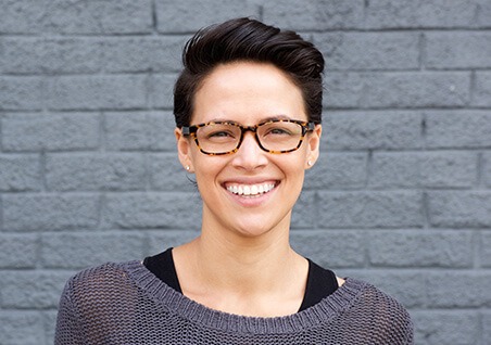 woman in glasses smiling