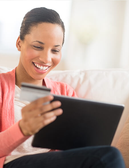 woman with computer and credit card