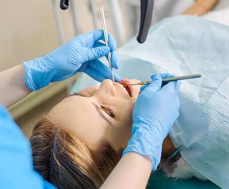 dentist examining a patient's teeth