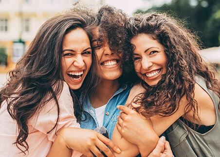 three women hugging