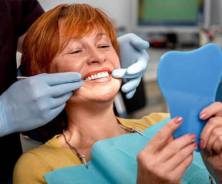 woman in dental chair smiling