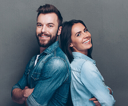 husband and wife smiling