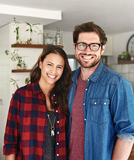 husband and wife smiling