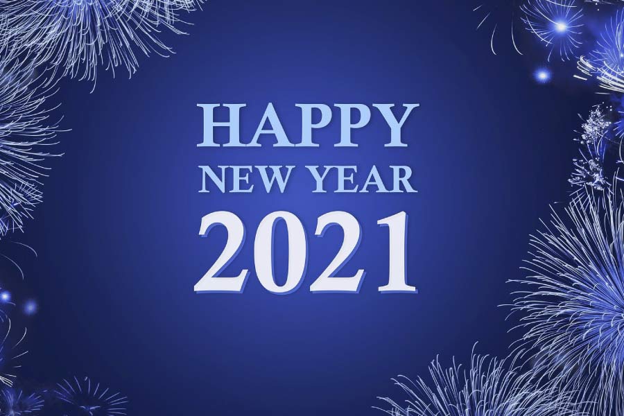 Happy New Year 2021 on a blue background bordered by fireworks.