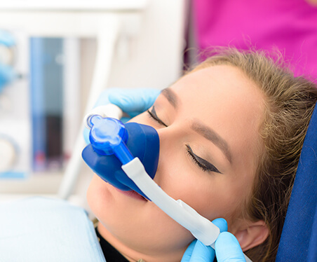 woman receiving nitrous oxide sedation