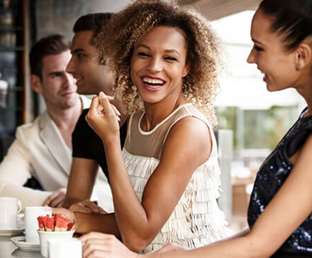 woman at a restaurant smiling