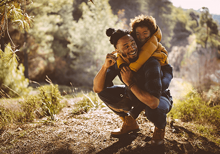 man with his son hiking