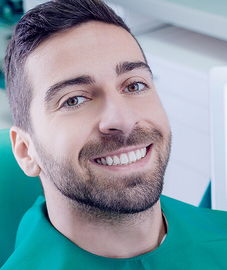 smiling man at the dentist